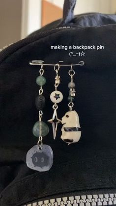 a back pack with some charms attached to it