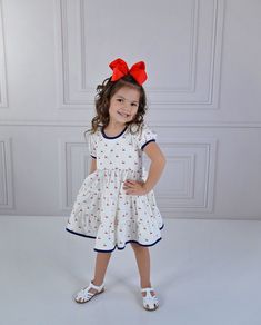 Serendipity Clothing Cherry Pie Charming Dress Style 23-36. Ready to ship! Sizing: Serendipity Clothing fits true to size. If you would like a personal measurement, please contact our shop at 214-517-0882. We offer matching bows & socks under accessories in our menu. Link: https://southernsweetchildren.com/collections/accessories Cute Short Sleeve Dress With Bow, Playful White Dress With Bow, Playful Sleeveless Dress With Bow, Cute White Dresses With Bow Print, Summer Cotton Dresses With Bow Print, Cotton Summer Dresses With Bow Print, Summer Cotton Dress With Bow Print, Casual A-line Dress With Bow, White Sleeveless Dress With Bow Print