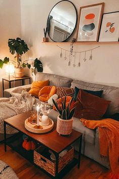 a living room filled with lots of furniture and plants on top of a coffee table