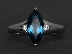 Welcome to my shop, you can find many beautiful gemstone jewelry here, and you also can ask for customized service. Main Stone: London blue topaz, marquise cut, measures 6X12mm, Accent Stones: cz Metal: 925 sterling silver plated with rhodium. I also can provide metal options such as 14k solid yellow/white/rose gold Setting: prong setting More rings please go to my shop home: https://www.etsy.com/shop/XCjewelryStudio?ref=hdr_shop_menu It's a perfect gift for the person who was born in November ( Formal Marquise Topaz Ring With Accent Stones, Elegant Marquise Blue Topaz Ring, Blue Marquise Topaz Ring, Marquise Blue Topaz Rings For Anniversary, Elegant Marquise Cut Blue Topaz Ring, Marquise Topaz Ring With Prong Setting For Promise, Marquise Cut Topaz Ring With Accent Stones For Anniversary, Elegant Marquise Cut Topaz Ring With Accent Stones, Elegant Blue Marquise Cut Topaz Ring