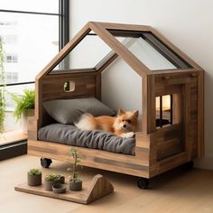 a small dog is sitting in a wooden house bed