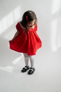 Please note, size up by one size due to length. See size chart in images. Transport back to a classic 1950s Christmas with this nostalgic red velvet dress. The sweet lace detail, collar, and puff sleeves add the perfect vintage touch to this style. Take the sweetest photos of your little ones in this festive dress that you can treasure for a lifetime. Wear with white tights and black patent leather mary janes for the perfect vintage look. 100% Polyester velvet Button closures on back Please note Christmas Dresses For Kids, Toddler Red Dress, Red Dress Black Tights, Patent Leather Mary Janes, Kids Christmas Dress, Toddler Christmas Dress, Festive Dress, 1950s Christmas, Red Christmas Dress