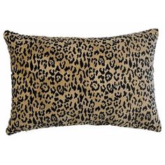 a leopard print pillow on a white background