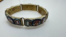 Beautiful Vintage 1930's Mosaic Italian Bracelet. This Bracelet is in Excellent Condition with Minimal Wear for it's Age. (Please See Photos for Condition) Please Don't Hesitate to Ask Any Questions You Might Have!?? Thanks For Looking and Don't Miss Out Vintage Adjustable Jewelry With Decorative Band, Vintage Beaded Bangle Bracelet, Vintage Beaded Bangle Bracelets, Vintage Jubilee Bracelet Jewelry For Ceremonial Use, Vintage Bangle With Decorative Band, Vintage Wedding Bracelets With Decorative Band, Vintage Beaded Bracelets For Formal Occasions, Vintage Wedding Bracelet With Decorative Band, Vintage Formal Bracelet With Decorative Band