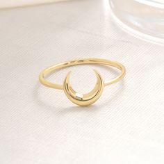 "Unique and dainty 14K solid gold (real & filled) moon personalized & custom ring can be best gifts for her (women, mom, mother, girlfriend, bridesmaid) Minimalist style handmade chunky,stacking and chevron crescent moon jewelry use as an engagement, promise, mothers day, wedding gift. 𝐓𝐡𝐞 𝐩𝐫𝐨𝐝𝐮𝐜𝐭 𝐢𝐧 𝐭𝐡𝐞 𝐢𝐦𝐚𝐠𝐞 𝐢𝐬 𝟏𝟒𝐤 𝐠𝐨𝐥𝐝, 𝐰𝐞 𝐡𝐚𝐯𝐞 𝟏𝟎𝐤 𝐨𝐩𝐭𝐢𝐨𝐧𝐬. Please carefully choose your ring size from the options menu during checkout! These items in our shop are handcrafted and made to order. Jewelry Details Band:14K Solid Gold Carat:585 There are 585 stamps in our rings. We are making Free Custom Engraving. Please type your engraving information in the \"Add your personalization\" box! Model Ring Size: The ring size on the model is 7 US. Items are shown large Moon Minimalist, Best Graduation Gifts, Crescent Moon Jewelry, Crescent Ring, Graduation Gifts For Daughter, Celestial Ring, Jewelry Details, Gold Ring Designs, Moon Ring