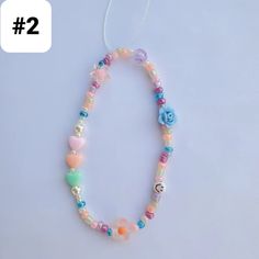 a necklace with hearts and flowers on it