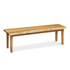 a wooden bench sitting on top of a white floor next to a table with two legs