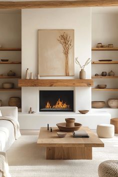 a living room filled with furniture and a fire place in the middle of the room