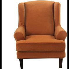 an orange chair sitting in front of a white background