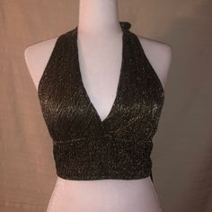 Black And Gold Brallette Tie Around The Neck And To The Back. Going Out Top!! Never Worn !! Chic Backless Crop Top For Party, Chic Gold Crop Top For Party, Glamorous Spring Halter Top For Night Out, Glamorous Halter Top For Night Out In Spring, Glamorous Halter Top For Spring Night Out, Chic Halter Neck Crop Top For Party, Trendy Evening Halter Neck Top, Chic V-neck Halter Top For Party, Elegant Gold Crop Top For Night Out