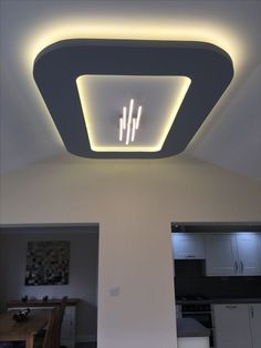 the ceiling light is on in this modern kitchen