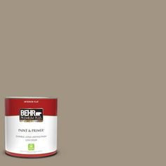 behr paint and primer is shown in the color light brown, with a white base