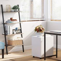 a living room with white walls and wooden blinds on the windowsills, a blue chair and a black table in front of it