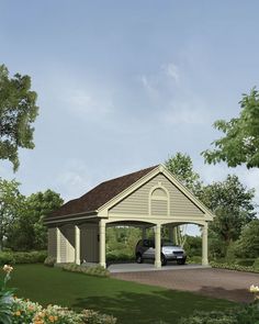 a garage with a car parked in it next to a lush green field and trees