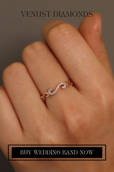 a woman's hand with a diamond ring on it and the words, buy wedding band now