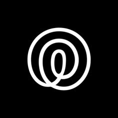 the letter q in a black and white circle on top of a black background with an oval