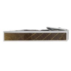 Cheers to this unique sterling silver tie clip inlaid with authentic whiskey barrel oak wood. It pairs perfectly with any of our whiskey oak rings for men and women. Opt for our whiskey barrel oak cuff links to complete your manly look. DETAILS OF THE TIE CLASPMetal Type: Sterling SilverFinish: PolishedDimensions: 5 mm wide, 35 mm long Inlay: Whiskey Barrel Oak Wood* Contact Us for help with any questions or special requests! *This tie clip is made with natural materials that have their own uniq Classic Brown Jewelry For Formal Events, Classic Brown Jewelry For Formal Occasions, Timeless Brown Business Jewelry, Timeless Brown Jewelry For Business, Formal Brown Jewelry With Polished Finish, Modern Brown Jewelry For Business, Classic Brown Engraved Jewelry, Whiskey For Colds, Wood Tie