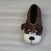 a close up of a slipper with a dog's face on it