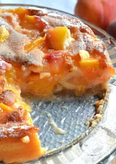 a piece of peach cake on a glass plate