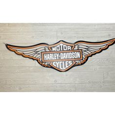 the harley davidson cycles logo is displayed on a wall