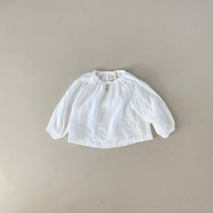 A beautiful, lightweight blouse featuring embroidery details. Made in South Korea Mom Care, Baby Embroidery, Embroidery Blouse, Embroidery Details, South Korea, Effortless Style, Embroidery, Cream