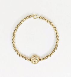 Gold bead bracelet with an evil eye charm. Carry around this symbol of protection wherever you go. Stack it with the Callan for an effortless, everyday look. All components are 14K gold filled. Bracelet is 7" . | Gold bead bracelet with an evil eye charm. Carry around this symbol of protection wherever you go. Stack it with the Callan for an effortless, everyday look. All components are 14K gold filled. Bracelet is 7" . | 1-800-Flowers Gifts Delivery Evil Eye Charm Bracelet Everyday Yellow Gold Evil Eye Bracelets, Gold Spiritual Evil Eye Bracelet For Everyday, Adjustable Gold Evil Eye Bracelet, Gold Adjustable Evil Eye Bracelet, Adjustable Gold Evil Eye Symbolic Bracelet, Adjustable Gold Evil Eye Bracelet For Everyday, Gold Evil Eye Bracelet For Everyday, Symbolic Gold Bracelets With Evil Eye, Gold Symbolic Bracelet With Evil Eye