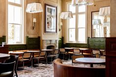 an empty restaurant with tables and chairs in it