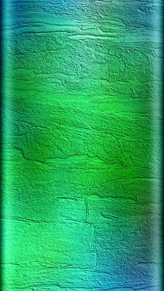 an abstract green and blue background with some light colored paint on the side of it