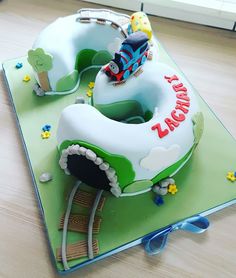 a cake shaped like a train on top of a table