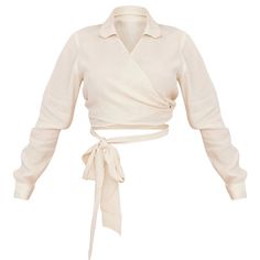 This Shirt Is All A Doll Needs To Catch The Gaze This Season. Featuring A Natural Linen Feel Material With A Double Wrap Around Fastening And Cropped Fit, We Are Obsessed. Pair With Comfy Bottoms And Gold Accessories To Complete The Look. Length Approx 33cm/13" (Based On A Sample Size Uk 8) Model Wears Size Uk 8/ Eu 36/ Aus 8/ Us 4 Model Height - 5ft 5" 80% Viscose 20% Polyester Chic Collared Cream Top, Chic Beige Spring Shirt, Cream Long Sleeve Top For Summer, Cream Long Sleeve Summer Tops, Beige Wrap Top For Day Out, Chic Beige Wrap Top, Cream Collared Tops For Spring, Beige Wrap Top For Spring, Trendy Wrap Top For Day Out