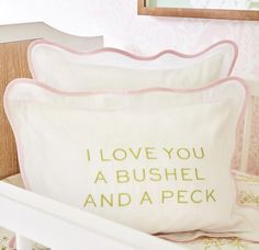 two pillows that say i love you a bushel and a peck on the pillow