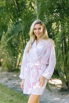 Soft and luxe, wear aprés bubble bath or as a beach coverup. Robes come wrapped in a lovely matching bag, making them the perfect gift or gift to yourself. Tassel detail on belt. One size. Choose long or short length. Feminine Beach Kimono For Summer, Summer Beach Robe With Tie Waist, Summer Vacation Robe With Tie Waist, White Beachwear Robe For Vacation, White Beachwear Robe For Beach, White Wrap Robe For Vacation, Chic Pink Beach Kimono, Summer White Kimono For Relaxation, White Feminine Summer Robe