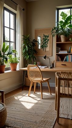 a home office with plants in the window sill and a rug on the floor