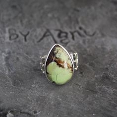 Lemon Chrysoprase Ring, Sterling Silver Ring, Lemon Chrysoprase Gemstone Jewelry For Mom, Chrysoprase Handmade Teardrop Stone Ring For Her Chrysoprase helps one to overcome compulsive or impulsive angry thoughts and behaviour, and turns your attention to positive events. Chrysoprase is a strong detoxifying stone. It is excellent for relaxation and promoting a peaceful night's sleep. This listing is for the following 1 (ONE) ring: ✦Gemstone :        Lemon Chrysoprase *may contain natural inclusions  ✦Stone Shape :    Pear Cabochon ✦Metal:                 925 Sterling Silver Dear customer you will receive the same piece or identical as shown in the picture. Since all gemstones are different from each other, I cannot guarantee the availability of the gemstone shown in the picture, but can gua Gift Ring With Large Chrysoprase Stone, Bohemian Green Opal Ring, Bohemian Green Rings With Natural Stones, Bohemian Green Chrysoprase Ring, Unique Adjustable Green Opal Ring, Adjustable Green Opal Bohemian Ring, Adjustable Green Ring With Large Stone, Adjustable Green Rings With Large Stone, Handmade Green Opal Bohemian Ring