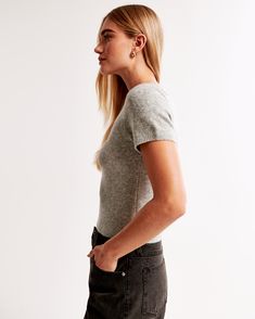 Elevate your everyday style with the Abercrombie & Fitch Women's Crew Sweater Tee in a chic Light Gray. This slim-fitting, short-sleeve tee is crafted from a luxuriously soft sweater yarn fabric, ensuring both comfort and a flattering fit.

- **Size**: Medium
- **Material**: Polyester, Nylon, Acrylic
- **Color**: Light Gray
- **Gender**: Female
- **Features**: Crew neckline, rib trim details along the banded hem and cuffs

Ideal for seamless transitions from office wear to evening outings, this Fine Knit Short Sleeve T-shirt For Fall, Fitted Short Sleeve Tops With Ribbed Cuffs, Classic Short Sleeve Knit Top With Relaxed Fit, Classic Relaxed Fit Short Sleeve Knit Top, Relaxed Fit Knit Top With Ribbed Crew Neck, Fitted Knit T-shirt With Short Sleeves, Classic Fitted Knit T-shirt, Classic Crew Neck Knit Top With Relaxed Fit, Classic Relaxed Fit Crew Neck Knit Top