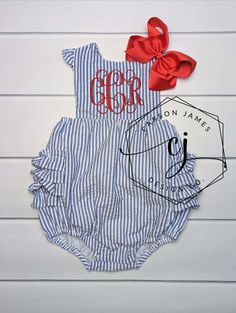 Check out this adorable monogrammed sunsuit! The perfect outfit to keep your little one cool yet stylish in those hot summer months! This sunsuit is navy and white seersucker with ruffle trim. Made from 100% cotton. It is fully lined (not see through) with snaps at the crotch and criss cross straps that button in the back. It also has elastic in the leg openings. A large monogram is embroidered directly onto the sunsuit using thread. Red thread will be used unless otherwise noted in notes to sel Fitted Cotton Bubble Romper For The Beach, Fitted Cotton Bubble Romper For Beach, Southern Baby Girl Outfits, Fitted Bubble Romper With Ruffles For Summer, Summer Fitted Bubble Romper With Ruffles, Fitted Ruffle Bubble Romper For Summer, Summer Gingham Cotton Bubble Romper, Fitted Summer Bubble Romper With Ruffles, Southern Baby