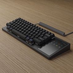 a computer keyboard sitting on top of a wooden table next to a mouse and pad