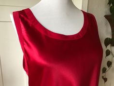 "100% silk. Size M. Slips over the head so allow for extra room. shown on mannequin with 34\" bust. Great condition with no notable flaws. Main brand tag has been removed but looks like it is a Victoria's Secret brand originally. Shoulders edge to edge:13\"-14\" pit to pit across chest:19\"-20\" armpit cycle:10.5\"/21\" across waist:20\"-21\" across bottom hem:21\"-22\" Total length:23\"-24.5\"" Red Silk Sleeveless Top, 90s Shirts, Brand Tags, Red Silk, Sleeveless Tank, Silk Top, Sleeveless Tank Top, Victoria's Secret, Silk Satin