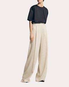 Brought to life in neutral-hued linen, these high-waisted pants add tailored appeal to their wide-leg silhouette with inverted front pleats. Pair with Sophie et Violà's Linen Tank Top in Sand for monochromatic styling. Zip closure High-rise waistline Wide-cut legs Inverted front pleats Side pockets Self: 70% linen, 30% viscose Lining: 100% polyester Dry clean Made in Spain Size & Fit Please note, below measurements reflect Sophie et Violà's size chart, not the actual garment. Size 34 (US 2): 31. Modern Wide-leg Linen Pants, Modern Linen Wide-leg Pants, Modern High-waisted Linen Wide Leg Pants, Modern Wide Leg Linen Pants, Modern Linen Wide Leg Pants For Workwear, Elegant Beige Relaxed Fit Wide Leg Pants, Neutral Wide Leg Pants For Formal Occasions, Formal Neutral Wide Leg Pants, Elegant High-waisted Linen Wide Leg Pants