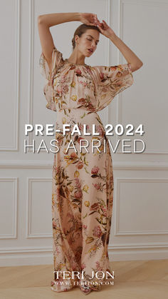 a woman in a floral print dress with her hands on her head and the words pre - fall 2014 has arrived