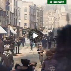 an old photo of people walking down the street