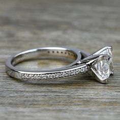 a white gold engagement ring set with a princess cut diamond