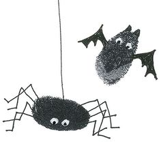 a spider hanging from a string with two bats on it's back and another bat in the air