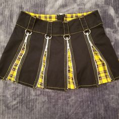 Vintage Tripp Nyc Zipper Skirt. Black Skirt With Zippers, D-Rings And Belt Loops. Can Be Worn With Zippers Close Or Open To Reveal Yellow Plaid. Size Medium Tripp Nyc Lip Service Goth Punk Grunge Alt Scene Alternative Emo Mall Goth Gothic 90s 2000 Killstar Dollskill Hot Topic Demonia Mall Goth Cottage Core Fairy Core Royal Bones Morbid Threads Hell Bunny Omen Raven Shrine Dark Academia Festival Rave Vintage Jeannie Nitro Punk Style Fitted Skirt With Zipper Closure, Tripp Skirt Outfit, Fitted Punk Skirt With Zipper Closure, Yellow Mini Pleated Skort, Nyc Tripp Pants, Tripp Nyc Top, Goth Cottage Core, Tripp Nyc Shorts, Vintage Tripp Nyc