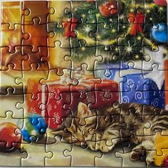 a puzzle piece with a cat sleeping on the floor next to christmas decorations and presents