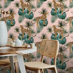 a wallpaper with leopards and palm leaves in pink, green and gold colors