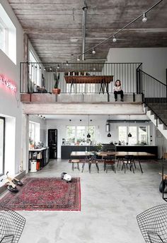 an open floor plan with stairs leading up to the upper level and dining room below