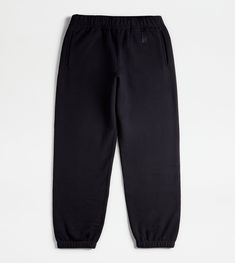 Jogger-style pants crafted in cotton fleece, with elastic waistband and bottom hem. Featuring welt vertical pockets, they come with the Tod's monogram embroidered on the front. A style that reinterprets an easy and refined urban taste at once. Easy E, Top Polo, Blue Joggers, Blue Back, Fashion Joggers, Style Pants, Gift Boutique, Cotton Fleece, Trainers Women