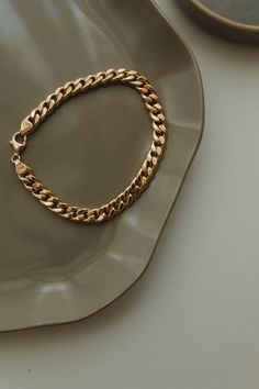 This 14K Gold Bracelet is a trendy bracelet that will bring a minimalist, modern, and fashion touch to your look. Its design is as elegant and simple and therefore is such a favorite piece and so easy to stack with other bracelets and bangles. Materials, - 14K Solid Gold Chain Bracelet - 8.5 Inches - 31 gr. - 8   Inches - 29 gr. - 7.5 Inches  -27 gr. - 7    Inches  - 25 gr. - 6.5 Inches  - 23 gr. Bangle has a bright finish. Available in yellow or white or rose gold. You can choose the thickness Modern Bracelets With Chunky Cuban Link Chain, Modern Chunky Chain Cuban Link Bracelets, Modern Chunky Cuban Link Chain Bracelet, Everyday Cuban Link Chain Bracelet With Solid Links, Classic Cuban Link Bracelet With Chunky Chain For Everyday, Everyday Tarnish Resistant Cuban Link Bracelets, Everyday Tarnish-resistant Cuban Link Bracelets, Everyday Tarnish-resistant Cuban Link Bracelet, Everyday Yellow Gold Cuban Link Bracelets