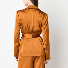 You'll feel on point for fall and beyond wearing this gorgeous earthy toned satin blazer. This slinky single-breasted style comes a notch lapel, button closures and a waist tie to define your figure. Wear it with a camisole or sleeveless top and palazzo pants.Front Style: Single BreastedClosure Type: ButtonFit: Regular FitPockets: 2 Front Slip PocketsSleeve Length: Long SleeveApparel Length: 32 InchesFiber Content: 100% PolyesterFabric Description: SatinCollar: Notch LapelCare: Machine Wash, Tum Satin Blazer, Palazzo Pants, Waist Tie, Single Breasted, Sleeveless Top, Satin, Blazer, How To Wear